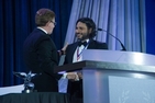 Hani Farsi accepts the Cyrus A. Ansary Award from Dr. Kerwin.